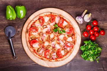 Meat pizza with tomatoes