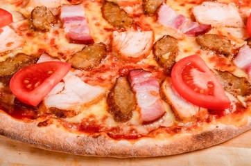 Meat pizza with tomatoes