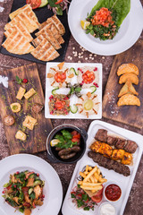 A set from shish kebabs, hummus, the house fried sausages, the Arab flat cakes and a sambusika