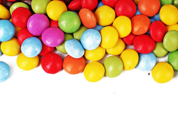 Colorful sugar coated chocolate drops. Yellow red purple green smaqrties candies