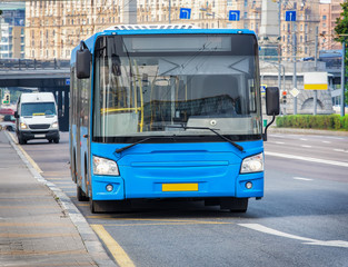 Fototapeta premium bus goes along street