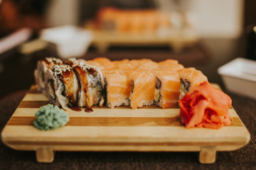 Sushi set roll served in traditional Japan wooden plate.