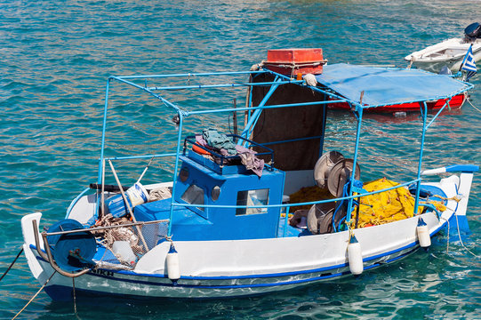 Traditional Greek wooden fishing boat at port of Sitia town in eastern part of Crete island, Greece