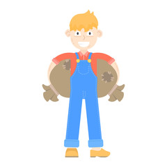 Farmer young dressed in a blue jumpsuit, keeps bags