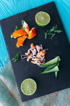 color seafood on the black stone board