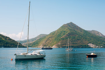 Fototapeta na wymiar Yachts, boats, ships in the Bay of Kotor, Adriatic Sea, Montenegro Balkans