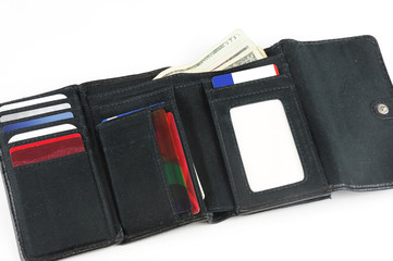 close up on black wallet with cards isolated on white background