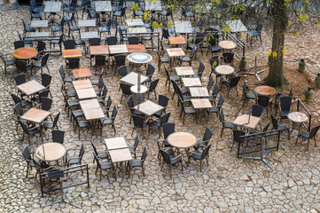 View from above outdoor empty tables and chairs of cafe
