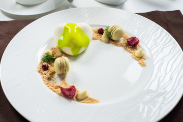 cake of ice cream on a white round plate