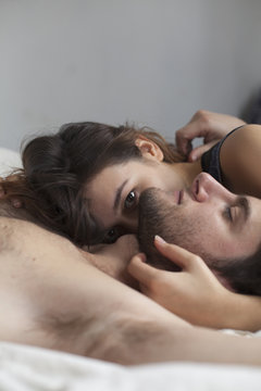 Portrait of a young couple lying down together