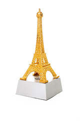 Gold eiffel tower in white studio background. Souvenir from Paris.