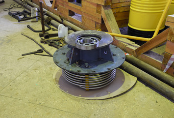 Disassembled element of an induction motor. Cooling pipes and ro