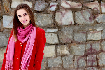 happy young woman in street on stone background