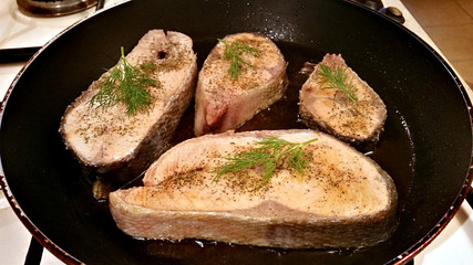 Fish steak fried in a pan
