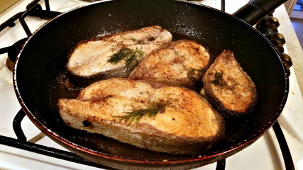 Fish steak fried in a pan