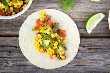 beef corn soft taco on rustic wood table