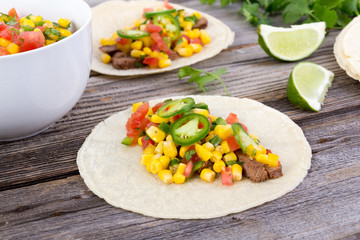 beef corn soft taco on rustic wood table