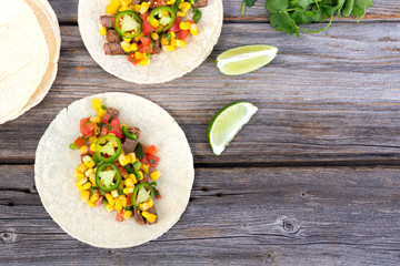 beef corn soft taco on rustic wood table