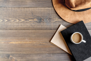 Writer workplace with tools on wooden background top view mock up