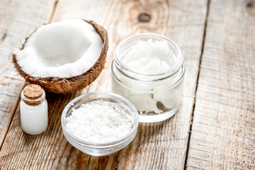 cosmetic concept with fresh coconuts on old wooden table background