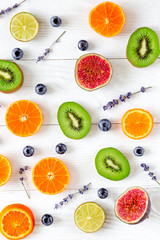 Fruit pattern on white desk background top view