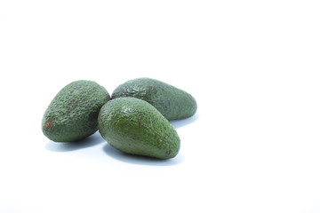 Fresh green avocados isolated in white background