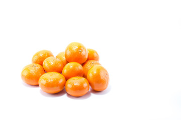 Fresh stack of shinning orange clementine isolated in white background