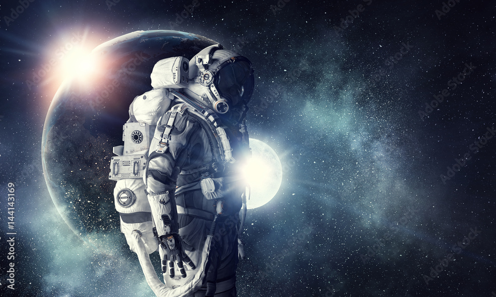 Wall mural astronaut in outer space. mixed media . mixed media