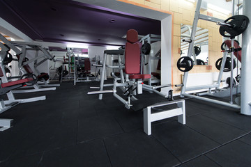 Fototapeta na wymiar Large Modern Gym With Workout Equipment