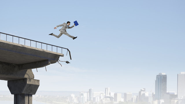 Business concept of businessman overcome the problems . Mixed media
