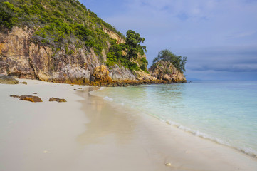 Fototapeta na wymiar paradise sea landscape with white sand and emerald ocean shore in Rawa Island Malaysia