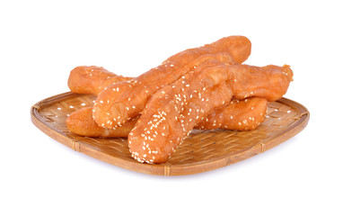 deep fried Chinese dough stick with white sesame on bamboo basket and on white background