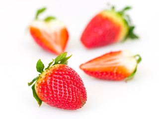 Red strawberries on white background.