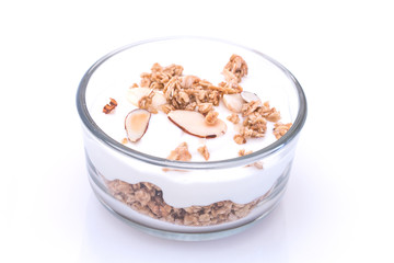 Yogurt with granola in glass bow.