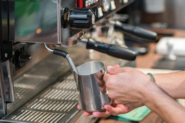 Making of cafe latte art, leaf shape
