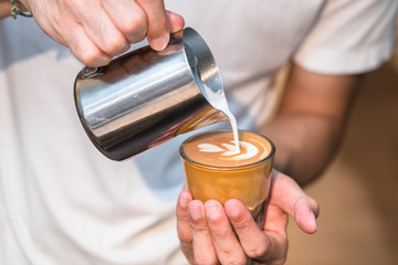 Making of cafe latte art, leaf shape
