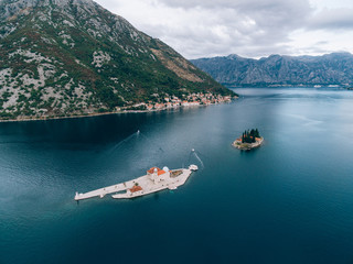 The island of Gospa od Skrpjela, Kotor Bay, Montenegro. Aerial survey of drones.