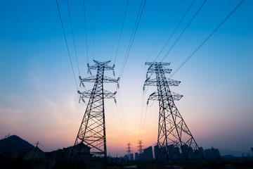 pylons in blue sky at sunrise