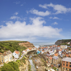Fototapeta na wymiar The tiny fishing village of Staithes and the Roxby Beck on the North Yorkshire coast, England