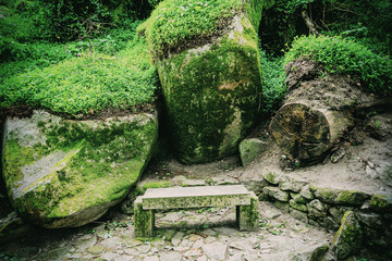 Stone bench in the park near the castle of the Moors. Sintra. Portugal