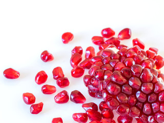 pomegranate seeds on white background