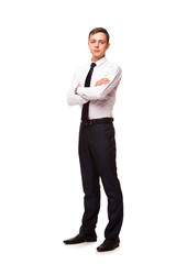 Young handsome businessman is standing crossed hands. portrait isolated on white background