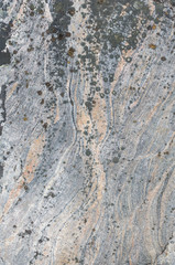 Texture of granite and lichen on it.