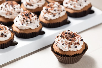 Coffee cupcakes with mocha buttercream and chocolate decorations