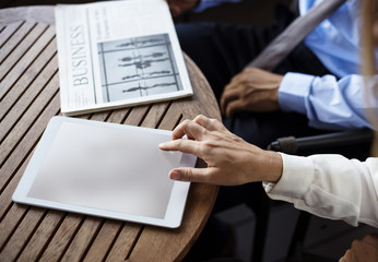 Businessmen Reading Newspaper Women Use Tablet