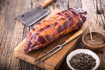 Pork meat.Pork chop smoked. Traditional smoked meat on oak wooden table in other positions.