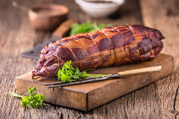 Pork meat.Pork chop smoked. Traditional smoked meat on oak wooden table in other positions.