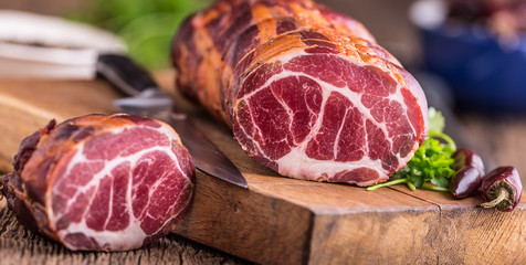 Pork meat.Pork chop smoked. Traditional smoked meat on oak wooden table in other positions.