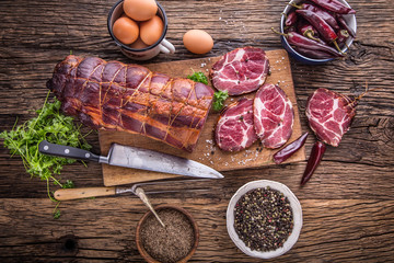 Pork meat.Pork chop smoked. Traditional smoked meat on oak wooden table in other positions.