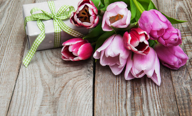 Spring tulips flowers and gift box